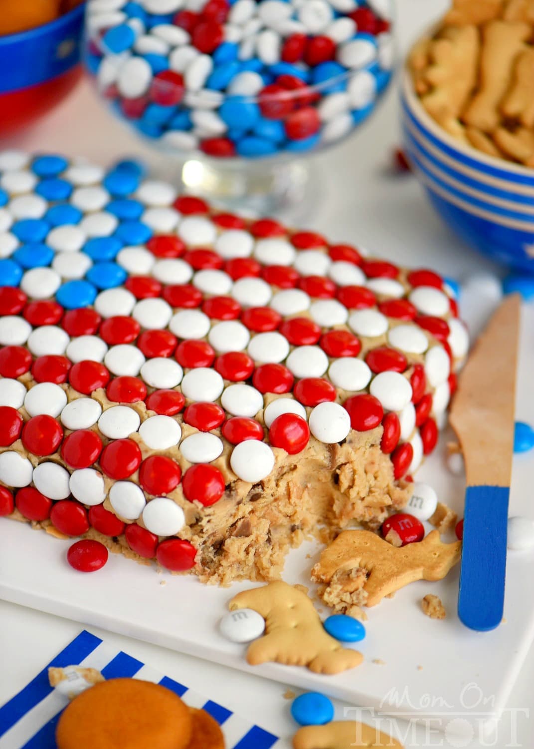 Celebrate with this outrageous Chocolate Chip Cookie Dough Flag Dip this 4th of July weekend! Edible chocolate chip cookie dough is loaded with toffee bits and peanut butter chips for the most delicious dip ever! Decorated in red, white, and blue, this easy dessert recipe is perfect for Memorial Day and Labor Day weekend as well!