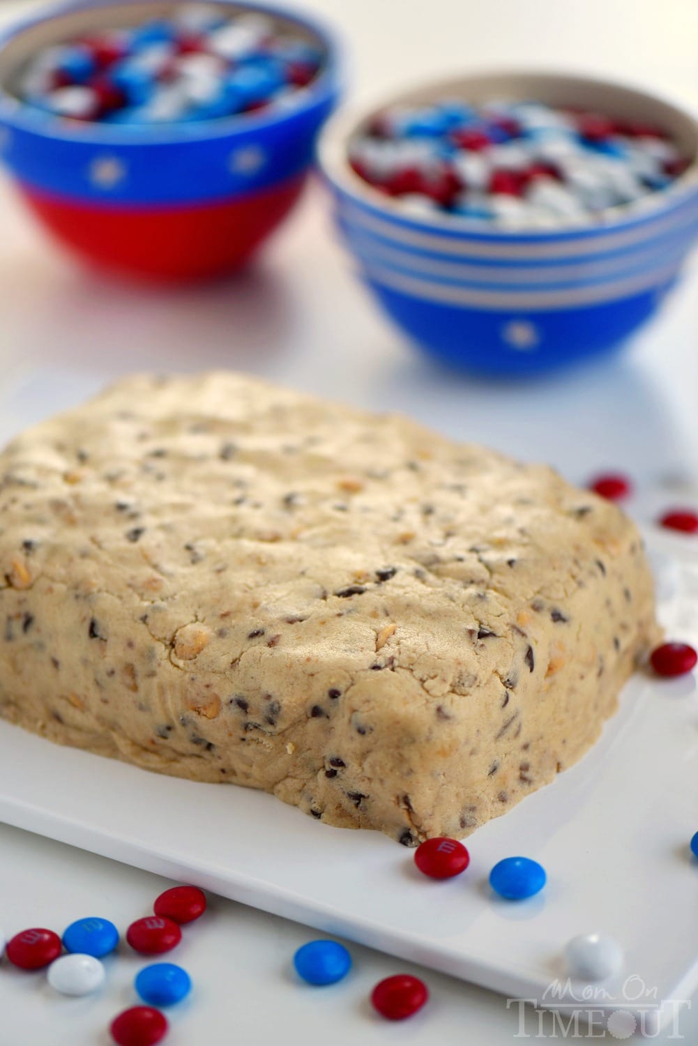 Celebrate with this outrageous Chocolate Chip Cookie Dough Flag Dip this 4th of July weekend! Edible chocolate chip cookie dough is loaded with toffee bits and peanut butter chips for the most delicious dip ever! Decorated in red, white, and blue, this easy dessert recipe is perfect for Memorial Day and Labor Day weekend as well!