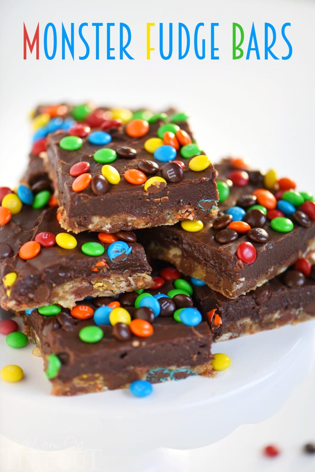 No one can resist these EASY Monster Fudge Bars! Oatmeal chocolate chip cookie bars topped with easy fudge and mini M&M's! This is one decadent treat!