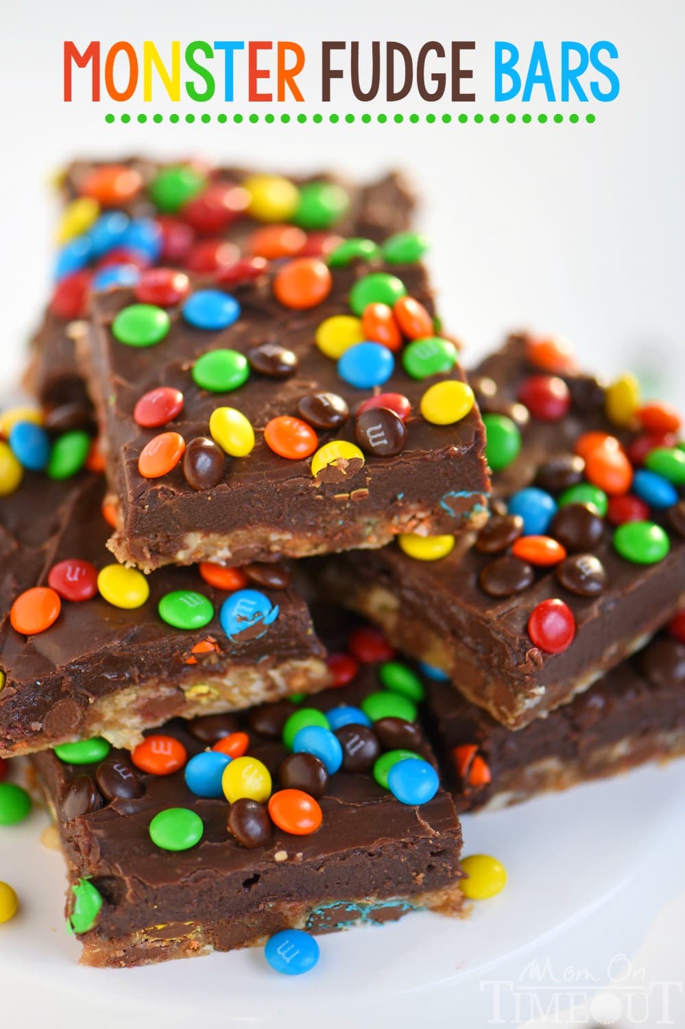 No one can resist these EASY Monster Fudge Bars! Oatmeal chocolate chip cookie bars topped with easy fudge and mini M&M's! This is one decadent treat!