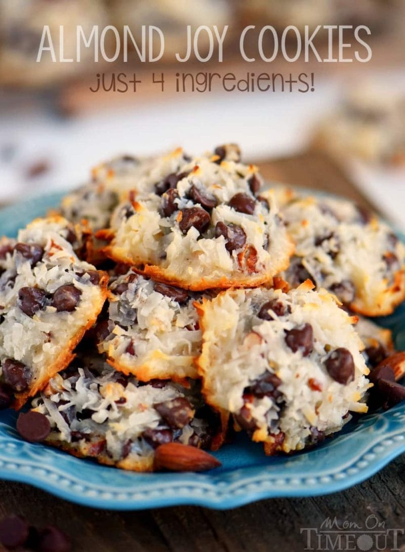 almond joy cookies piles high on a blue plate with title overlay at top