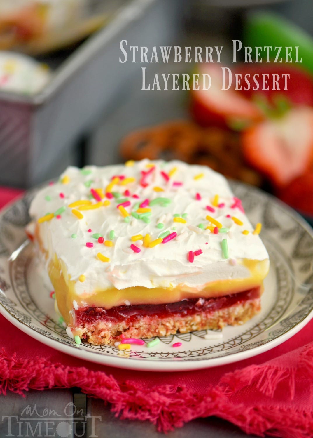 This easy No Bake Strawberry Pretzel Layered Dessert is sure to become a new family favorite! A graham cracker-pretzel crust is topped with a sweet strawberry jell-o layer, rich vanilla pudding and creamy whipped topping! Don't forget the sprinkles!