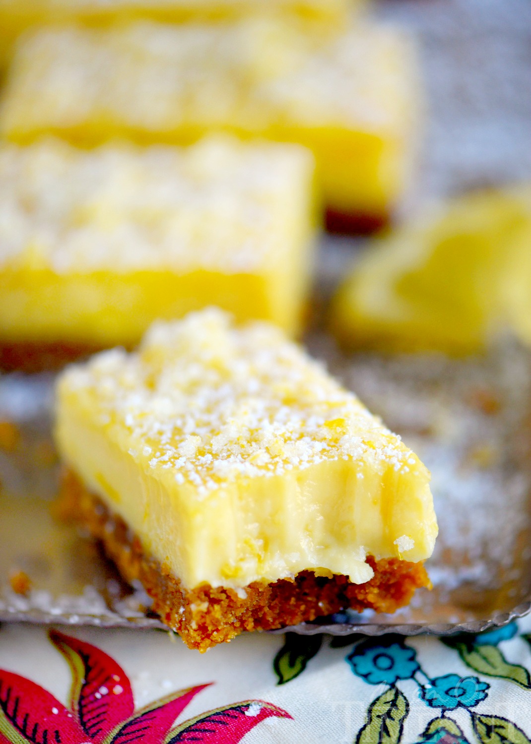 These Lemon Drop Bars are extra creamy and topped with candied lemon zest for the BIGGEST lemon flavor possible! So easy to make, deliciously sweet and tart, you'll find these Lemon Drop Bars hard to resist! 