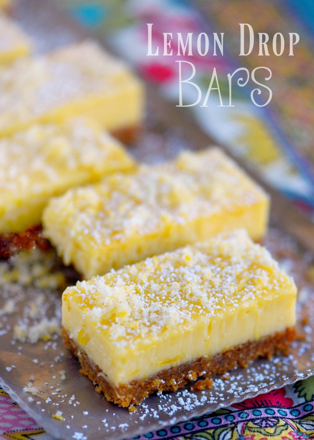 These Lemon Drop Bars are extra creamy and topped with candied lemon zest for the BIGGEST lemon flavor possible! So easy to make, deliciously sweet and tart, you'll find this treat hard to resist!
