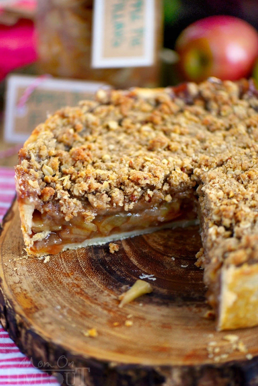 Deep Dish Dutch Apple Pie is loaded with a spiced apple filling and topped with a crunch, sweet, pecan streusel topping. Best served with a big scoop of vanilla ice cream and caramel sauce. This is THE dessert for the fall season! | Mom On Timeout