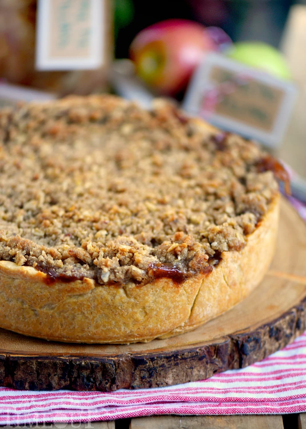 Deep Dish Dutch Apple Pie is loaded with a spiced apple filling and topped with a crunch, sweet, pecan streusel topping. Best served with a big scoop of vanilla ice cream and caramel sauce. This is THE dessert for the fall season! | Mom On Timeout