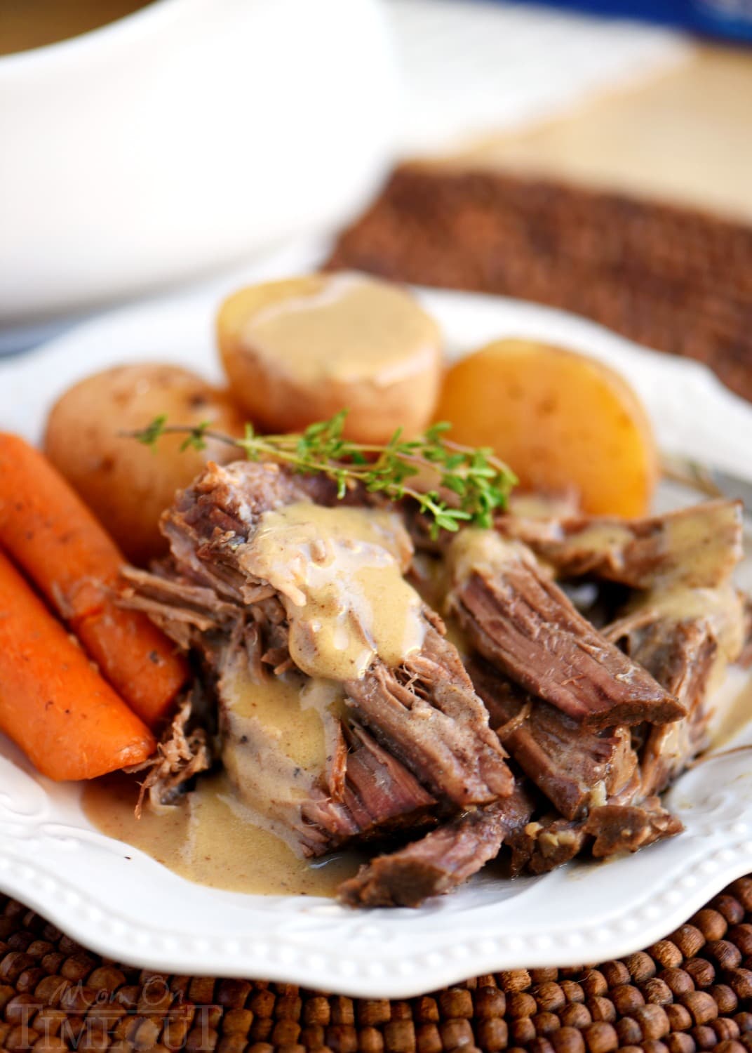 pot roast recipe with gravy on plate with potatoes and carrots