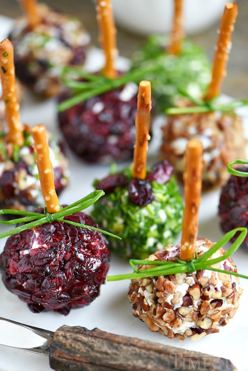 Holiday entertaining has never been easier or more delicious with these Cranberry Pecan Mini Goat Cheese Balls! So easy to make and gorgeous too! Perfect for Thanksgiving, Christmas, and New Year's! (Can be made in advance!) // Mom On Timeout