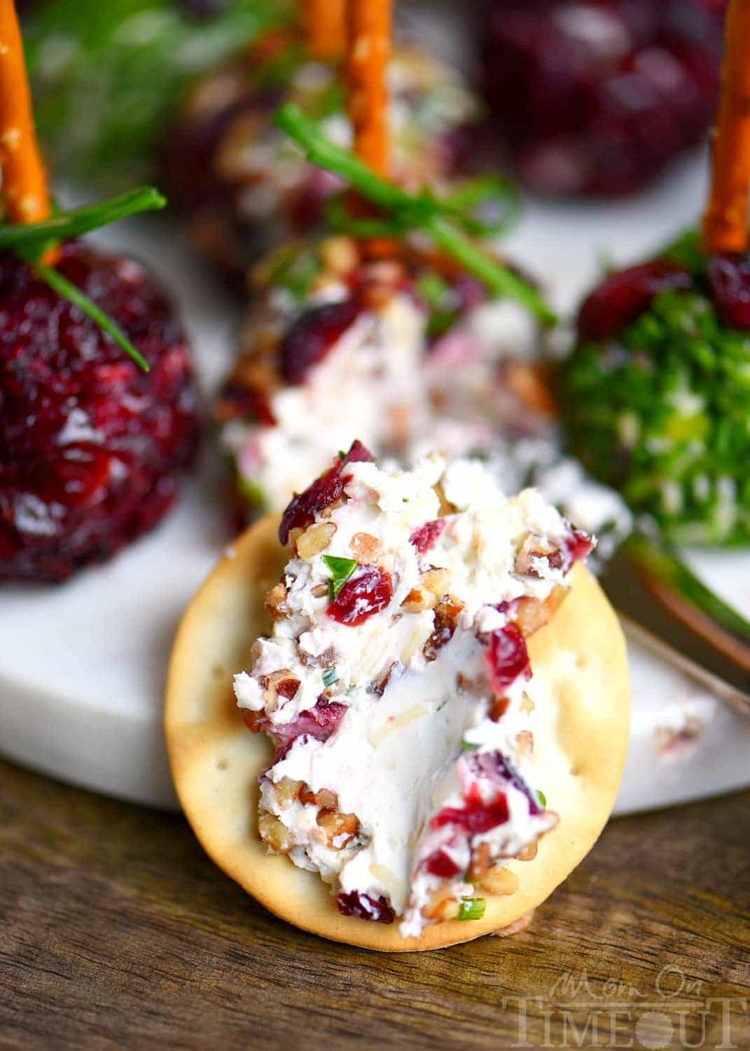 Holiday entertaining has never been easier or more delicious with these Cranberry Pecan Mini Goat Cheese Balls! So easy to make and gorgeous too! Perfect for Thanksgiving, Christmas, and New Year's! (Can be made in advance!) // Mom On Timeout