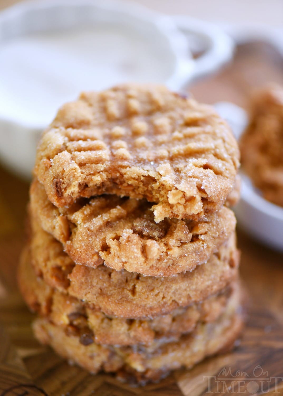 These easy, 5-ingredient Flourless Toffee Peanut Butter Cookies are the most peanut-buttery cookie EVER! The perfect cookie for peanut butter lovers! Serve with an ice cold glass of milk for extreme satisfaction! // Mom On Timeout