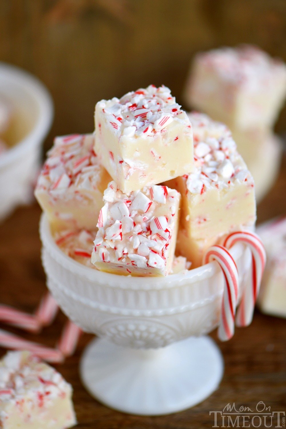 Tis the season for peppermint and sweets! You can have the best of both with this Practically Perfect Peppermint Fudge! Just a handful of ingredients and five minutes are all you need to make this pretty and festive fudge! // Mom On Timeout