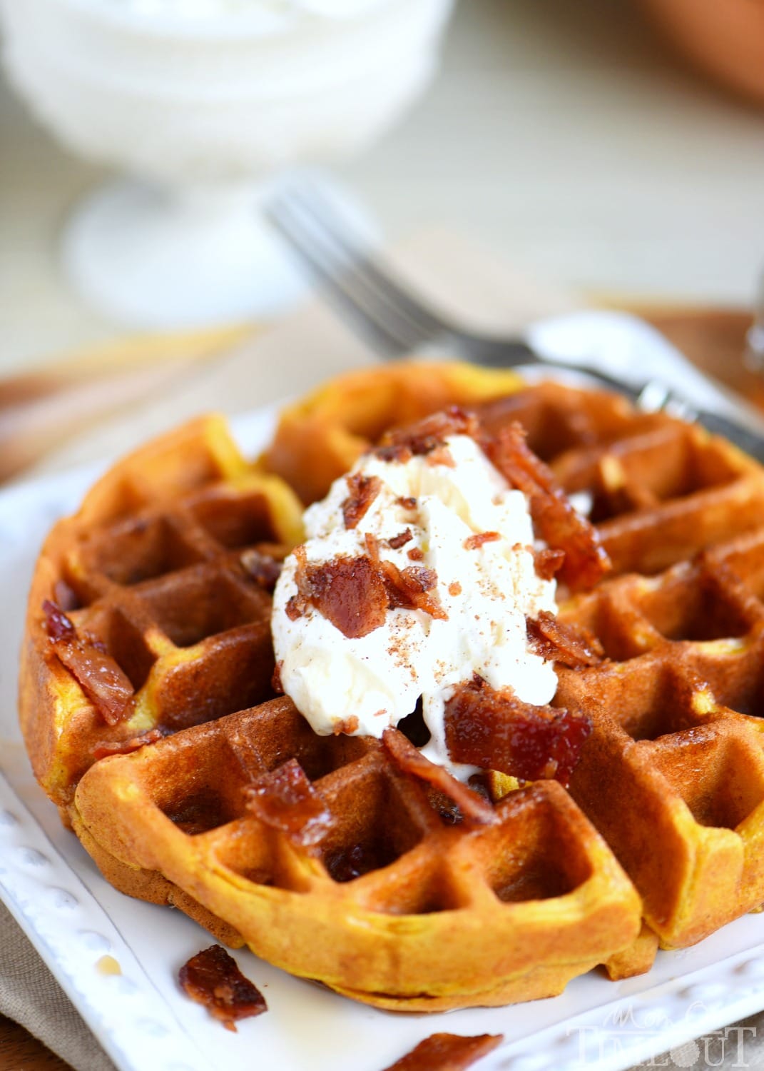 These Pumpkin Spice Maple Bacon Waffles are the perfect way to celebrate the most important meal of the day! Great for the holidays and all fall long! You're going to love the spiced maple bacon that's inside each waffle - so good! // Mom On Timeout