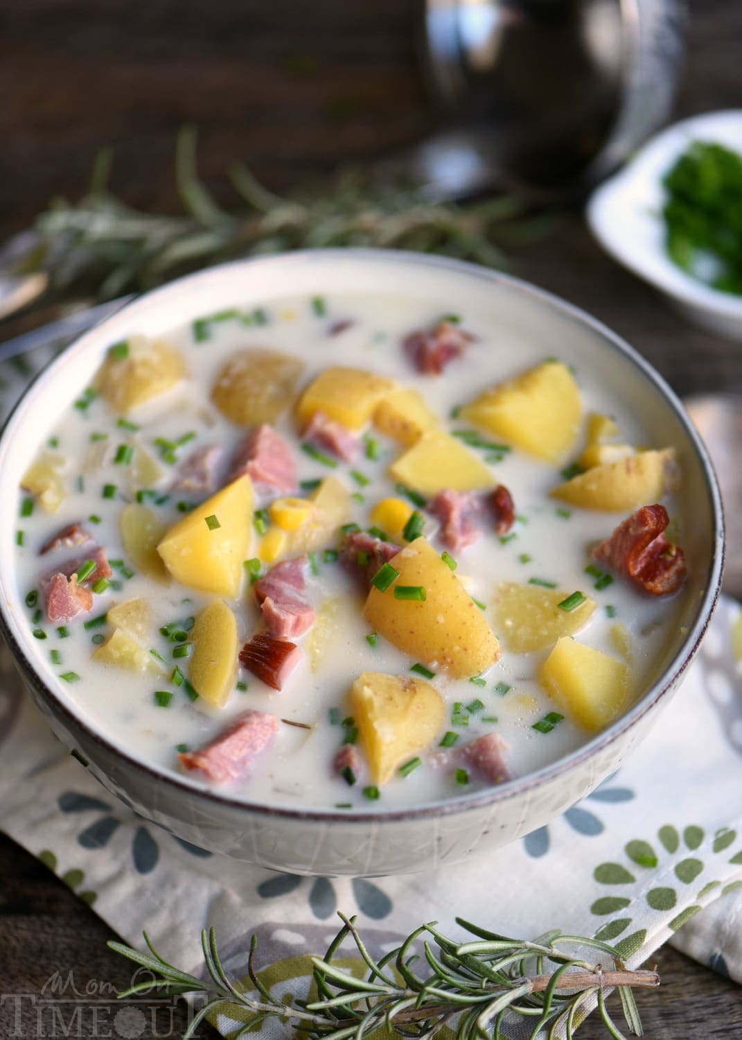 Love slow cooker recipes? This one is for you! This Slow Cooker Rosemary Potato Soup with Ham and Corn is all about filling your belly with goodness and warmth! Weeknight dinners have never tasted this good! // Mom On Timeout