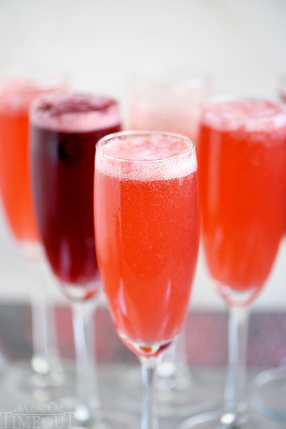 This Berry Champagne Punch is the perfect way to kick off New Year's Eve! This punch is super easy to prepare and is made with fresh berries and champagne or sparkling wine. Perfect for Easter brunch and Mother's Day too! // Mom On Timeout