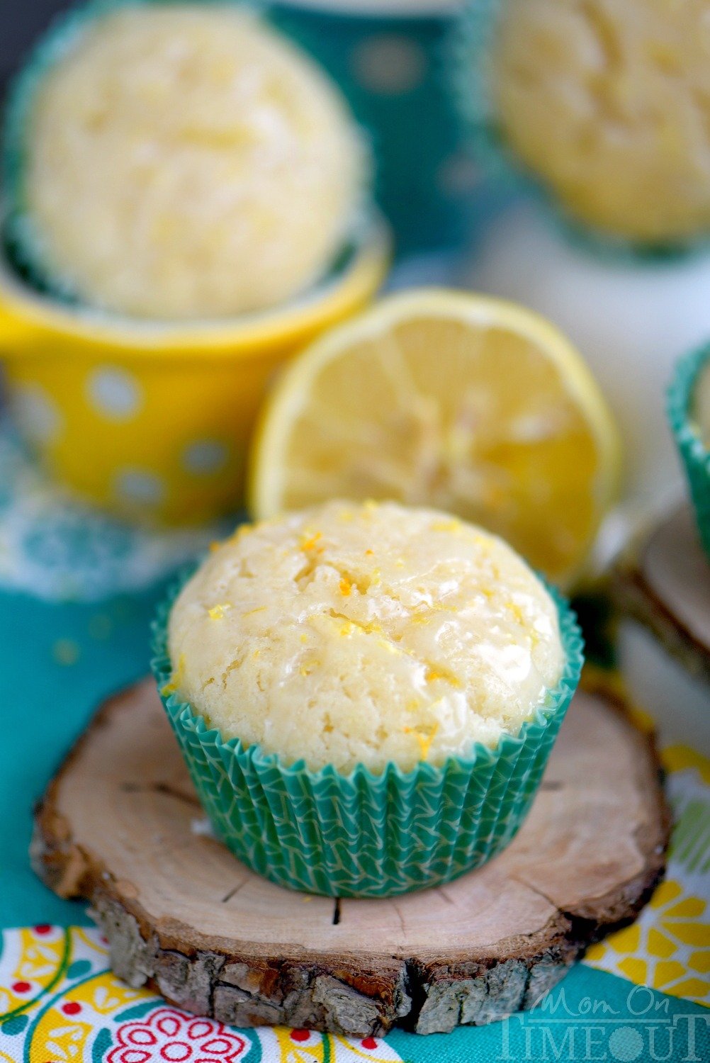 These Skinny Lemon Muffins are made with Greek yogurt, coconut oil and plenty of lemon zest for a fabulous bright, lemon flavor! So tender and moist, these muffins are a great way to start to your day! // Mom On Timeout