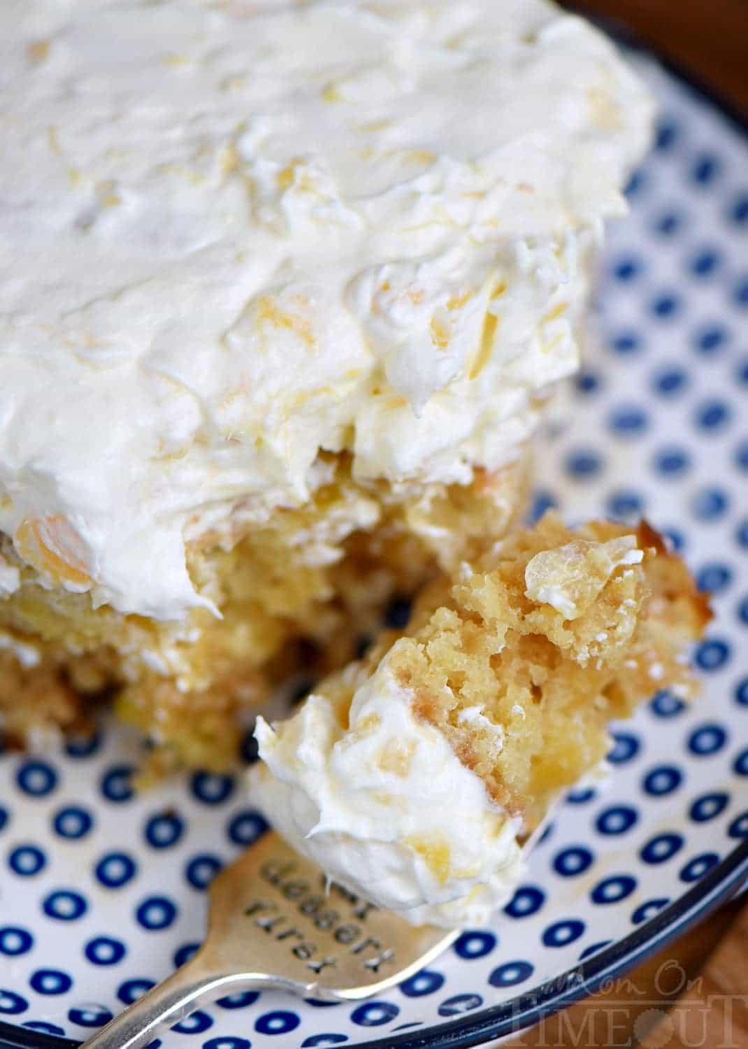 This Practically Perfect Pineapple Cake is loaded with pineapple flavor! Made without butter or oil, it's incredibly moist and topped with a delicious pineapple fluff frosting! // Mom On Timeout