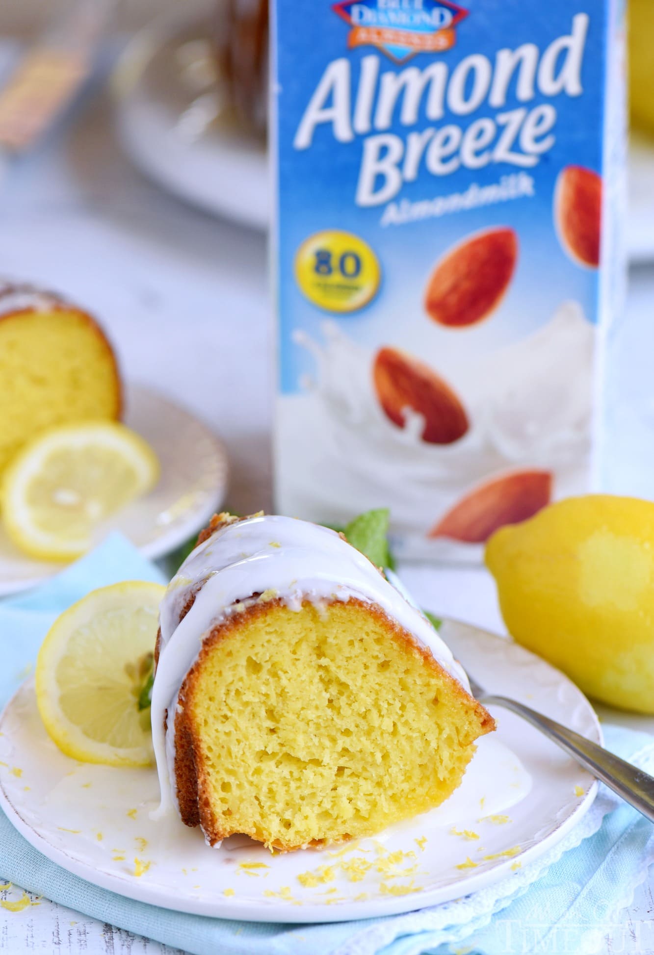 Looking for an easy lemon dessert recipe that is going to WOW your friends and family? This Easy Lemon Bundt Cake is the answer! A breeze to make and loaded with bright lemon flavor, this easy cake recipe is also figure-friendly which makes it perfect for summer! // Mom On Timeout