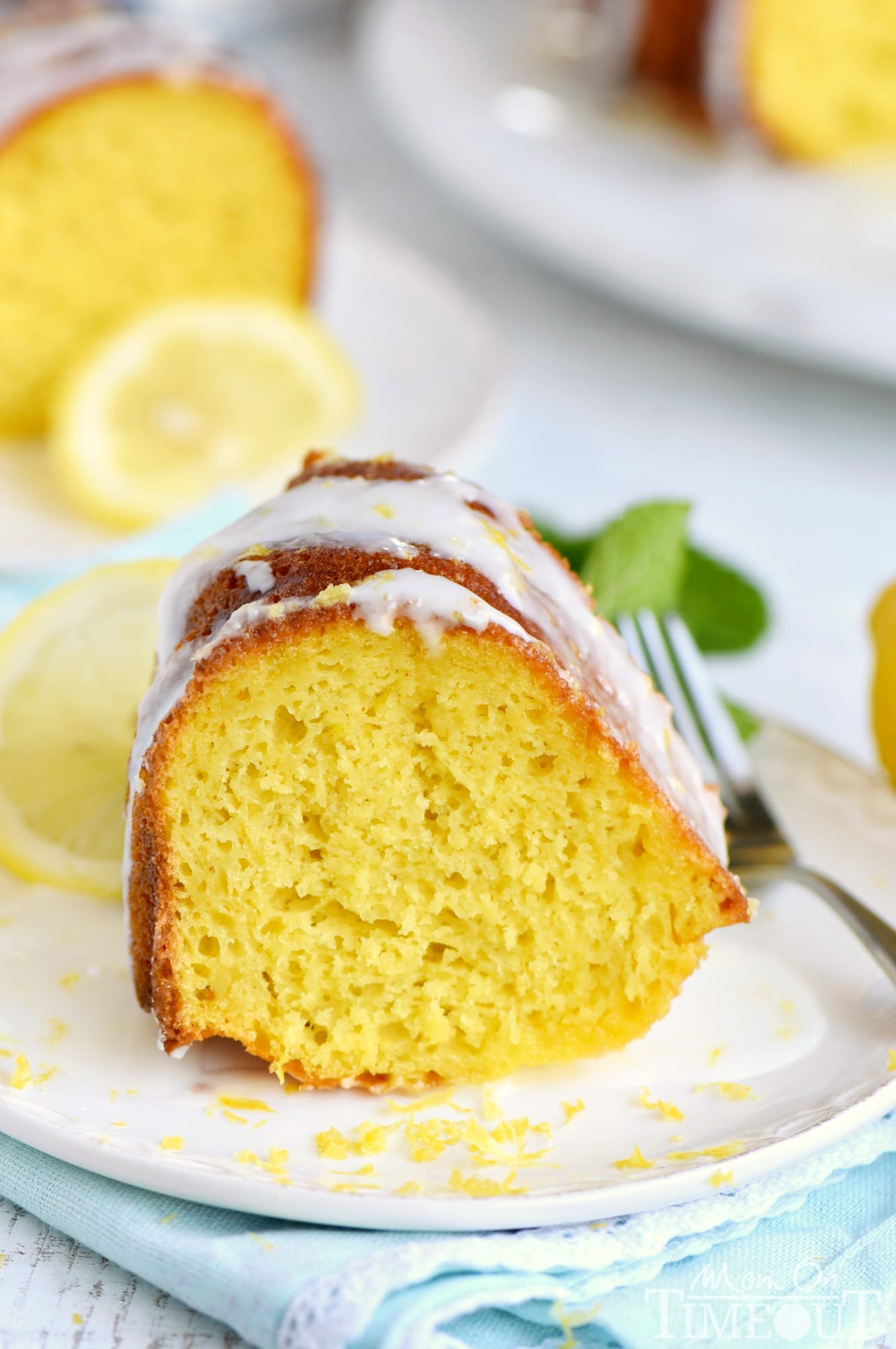 Looking for an easy lemon dessert recipe that is going to WOW your friends and family? This Easy Lemon Bundt Cake is the answer! A breeze to make and loaded with bright lemon flavor, this easy cake recipe is also figure-friendly which makes it perfect for summer! // Mom On Timeout