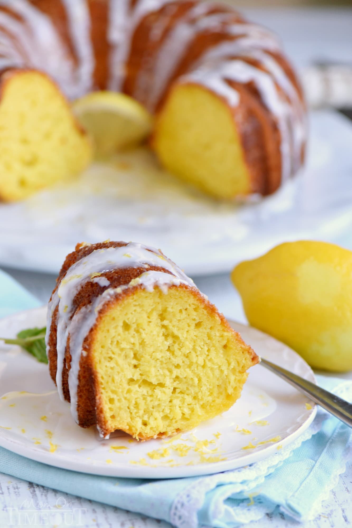 Looking for an easy lemon dessert recipe that is going to WOW your friends and family? This Easy Lemon Bundt Cake is the answer! A breeze to make and loaded with bright lemon flavor, this easy cake recipe is also figure-friendly which makes it perfect for summer! // Mom On Timeout