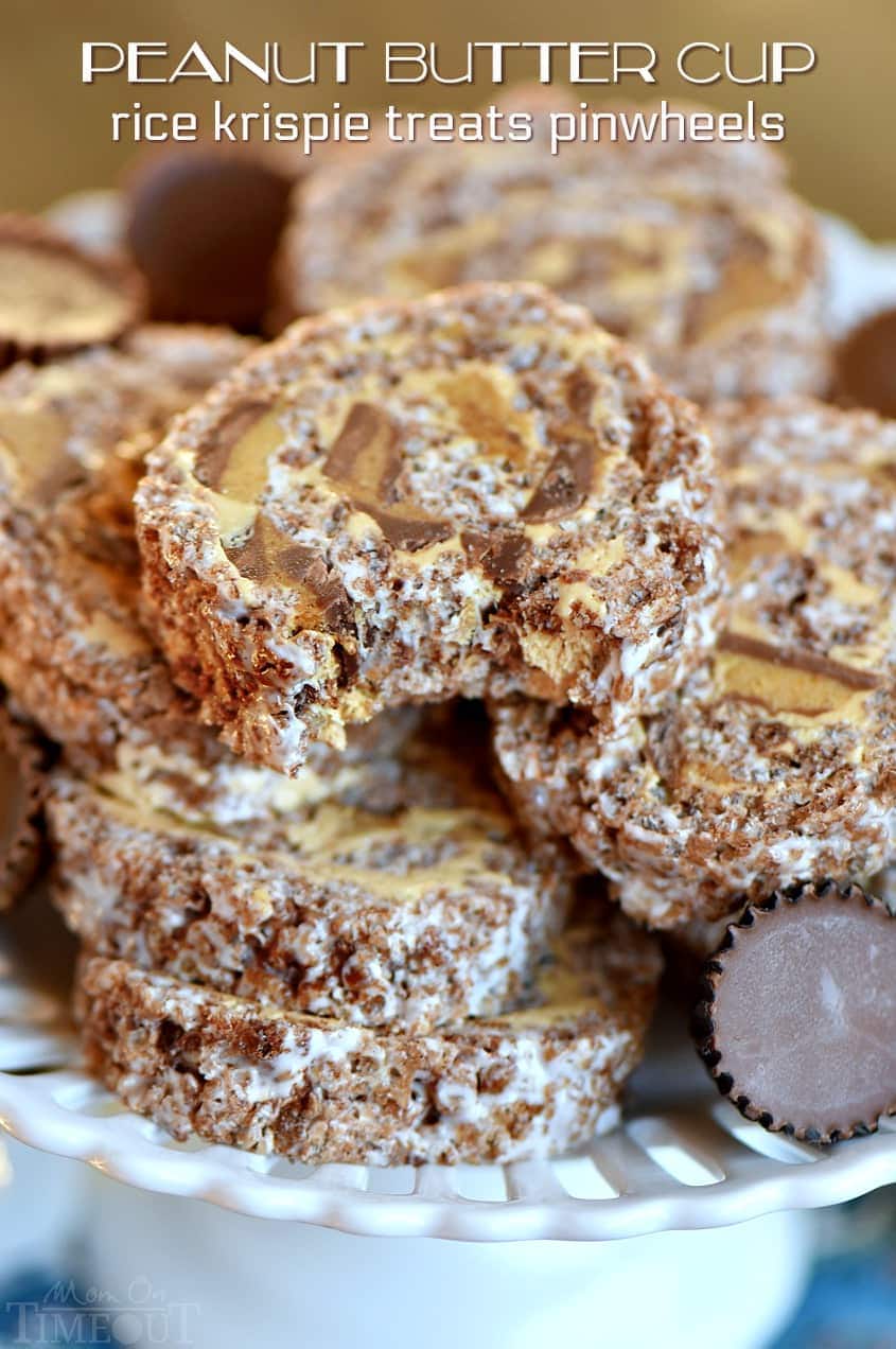 These Peanut Butter Cup Rice Krispie Treats Pinwheels are my new favorite treat and sure to be a hit with the peanut butter lover in your life. Layers of chocolate, marshmallow, peanut butter and peanut butter cups are rolled up into an irresistible dessert! Great for parties! // Mom On Timeout