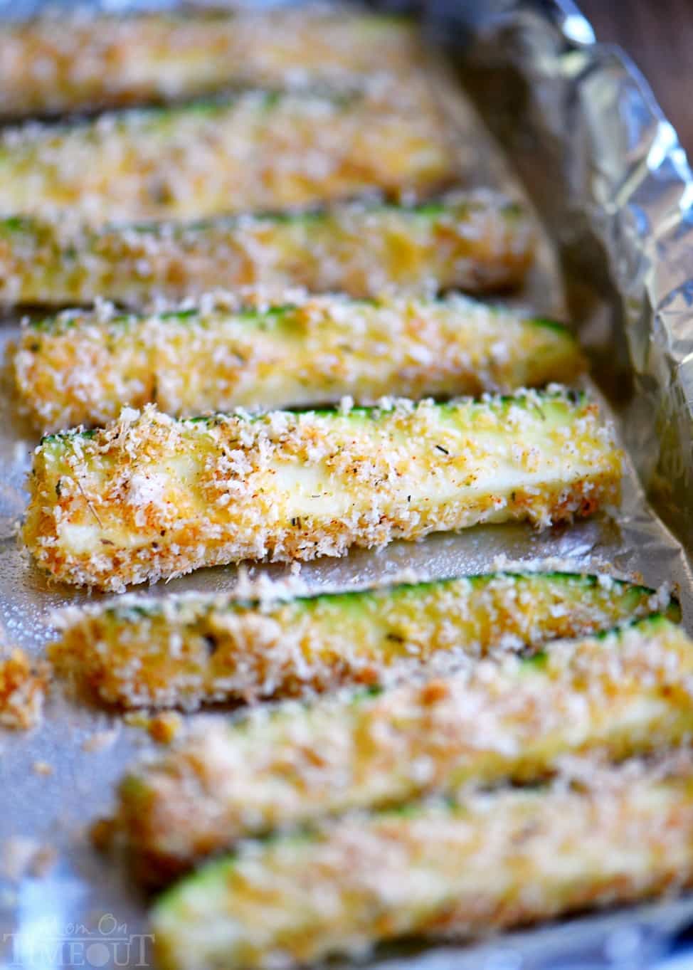 Your new favorite way to eat zucchini! These Baked Parmesan Zucchini Fries are loaded with flavor and baked to golden perfection! The perfect way to use up your summer bounty! // Mom On Timeout