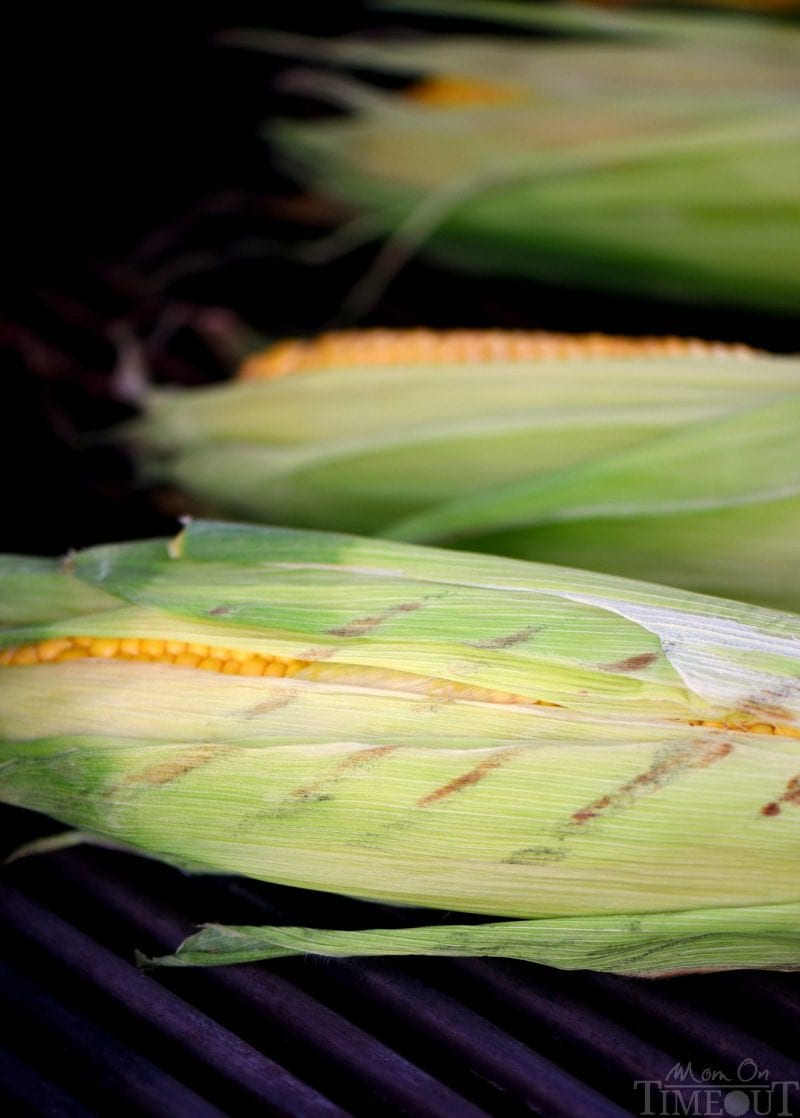 Nothing says summer like corn on the cob! This Grilled Corn with Herb Butter is sure to be a delightful addition to your summer entertaining menu. So easy to prepare and always a big hit with your family! // Mom On Timeout