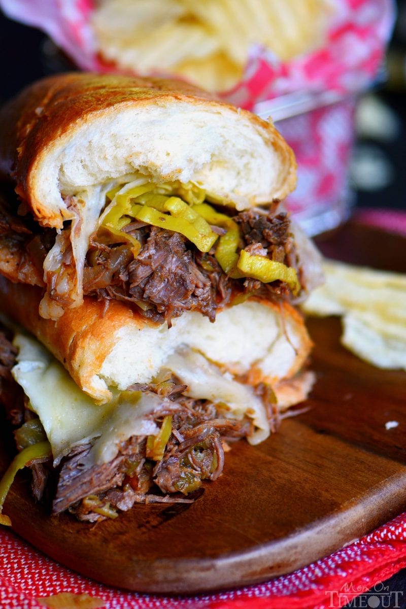 easy-italian-beef-sandwich-cut in half on cutting board