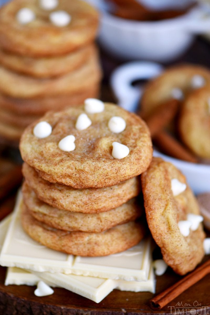 white chocolate snickerdoodles stacked on squares of white chocolate