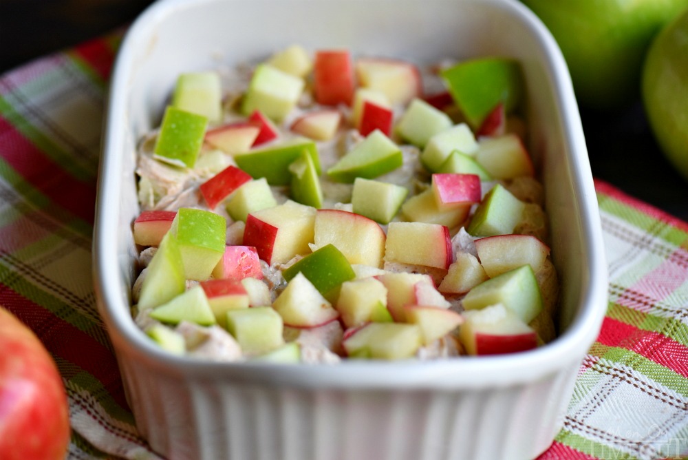 ingredients in baking dish topped with apples