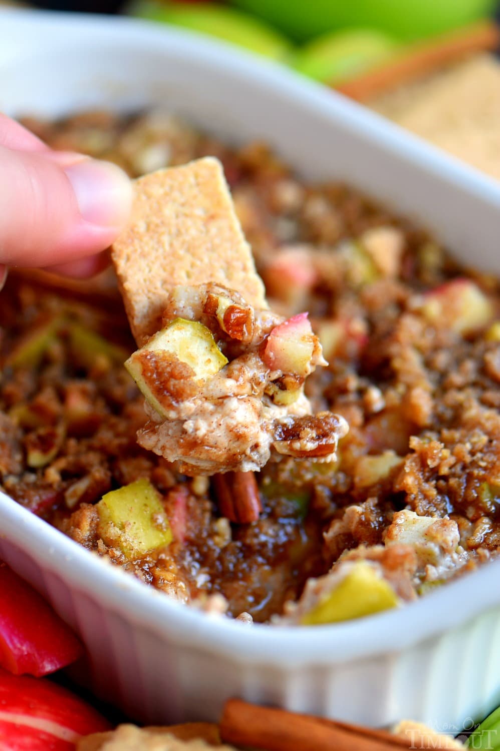 graham crackers dipping into apple dip