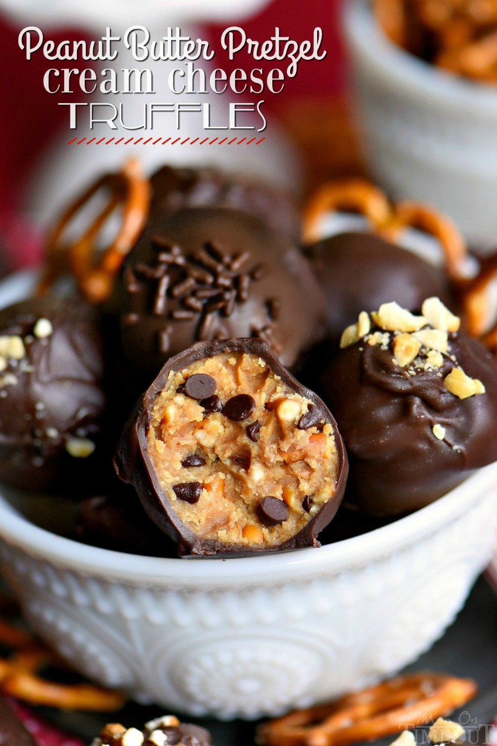 It's not a party without these easy Peanut Butter Pretzel Truffles! Extra creamy and delicious and loaded with peanut butter, chocolate chips, and pretzels! The ultimate sweet and salty combination! // Mom On Timeout #peanutbutter #pretzel #chocolate #candy #truffle #recipe #ad
