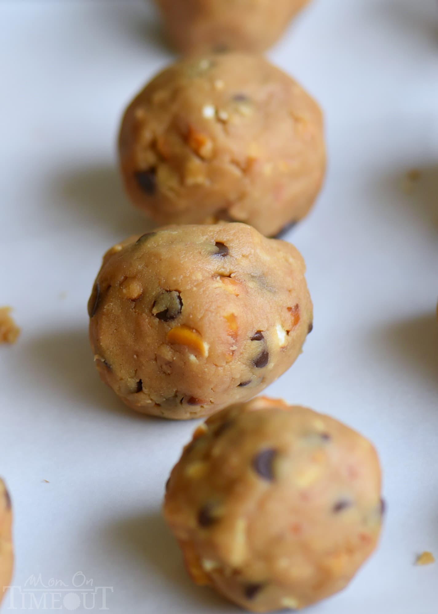 It's not a party without these easy Peanut Butter Pretzel Truffles! Extra creamy and delicious and loaded with peanut butter, chocolate chips, and pretzels! The ultimate sweet and salty combination! // Mom On Timeout 