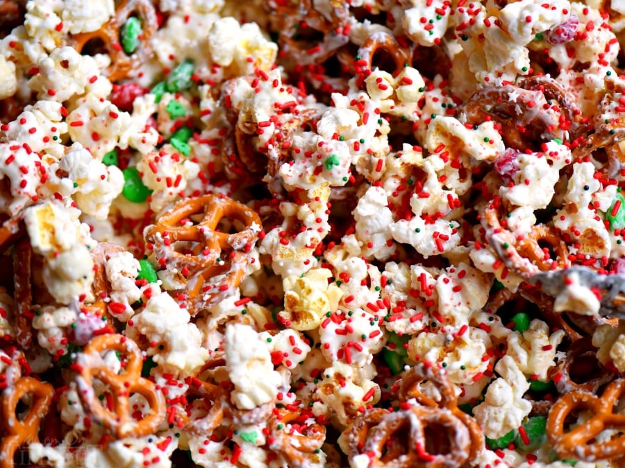 This wonderful holiday Snow Day Snack Mix is the perfect easy treat all winter long! Both sweet and salty, this holiday snack mix is great for Christmas, movie nights, parties, gifts and so much more! // Mom On Timeout #christmas #dessert #snack #pretzels #marshmallows #redandgreen #momontimeout