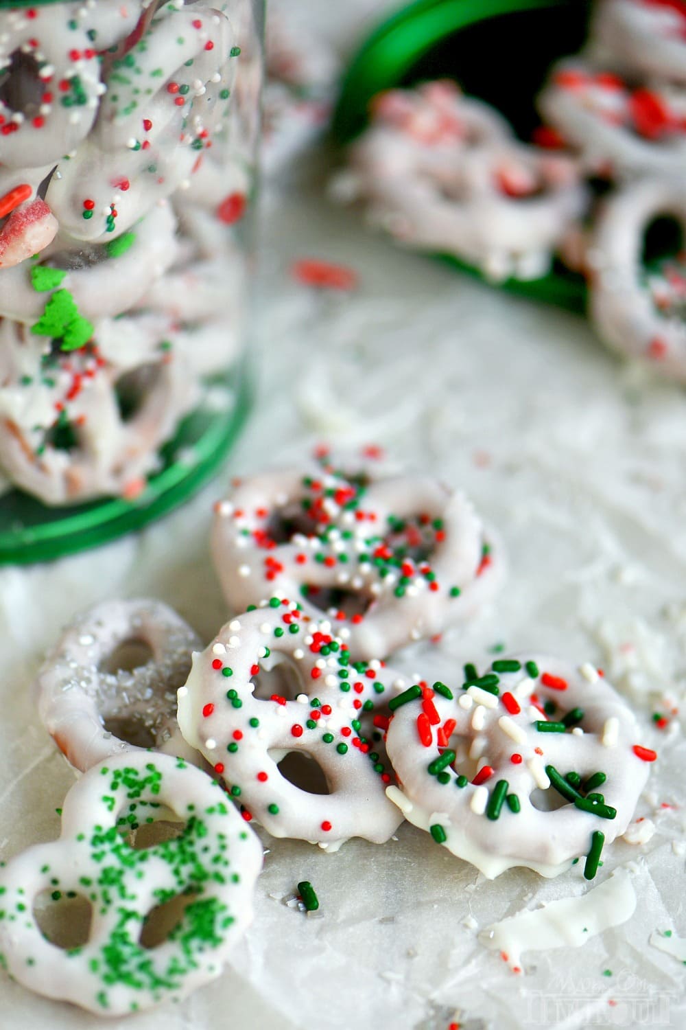 Step by step instructions for the perfect easy White Chocolate Covered Pretzels! Learn how to get perfectly dipped pretzels every time! Decorate with your favorite sprinkles and candies for a holiday treat everyone will love! Great for Christmas and the holidays!