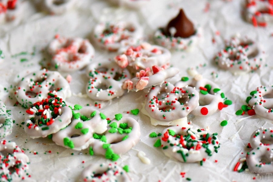 Step by step instructions for the perfect easy White Chocolate Covered Pretzels! Learn how to get perfectly dipped pretzels every time! Decorate with your favorite sprinkles and candies for a holiday treat everyone will love! The perfect addition to cookie trays!