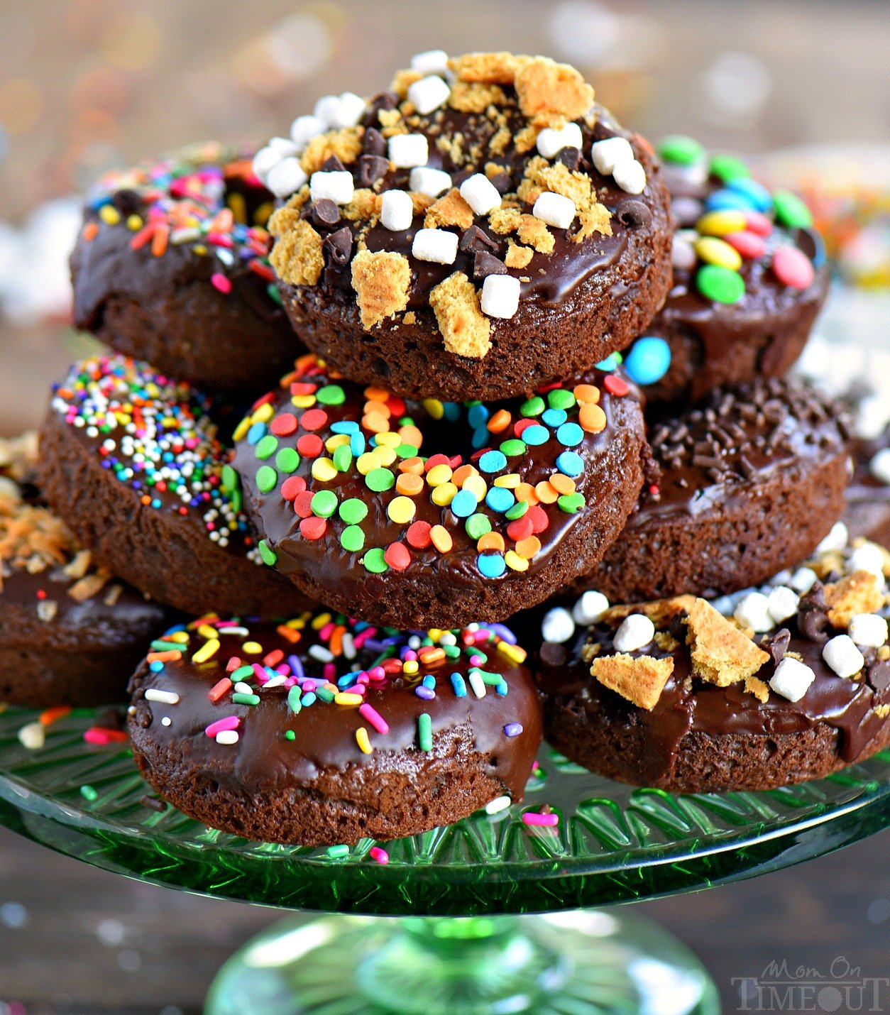 Give me ALL the donuts! Start your mornings off right with CHOCOLATE! These Chocolate Cake Mix Donuts are topped with a silky chocolate glaze and an assortment of fun toppings. S'mores, Almond Joy, sprinkles - which will be your new favorite? // Mom On Timeout #donuts #chocolate #cakemix #breakfast #brunch #dessert #ad