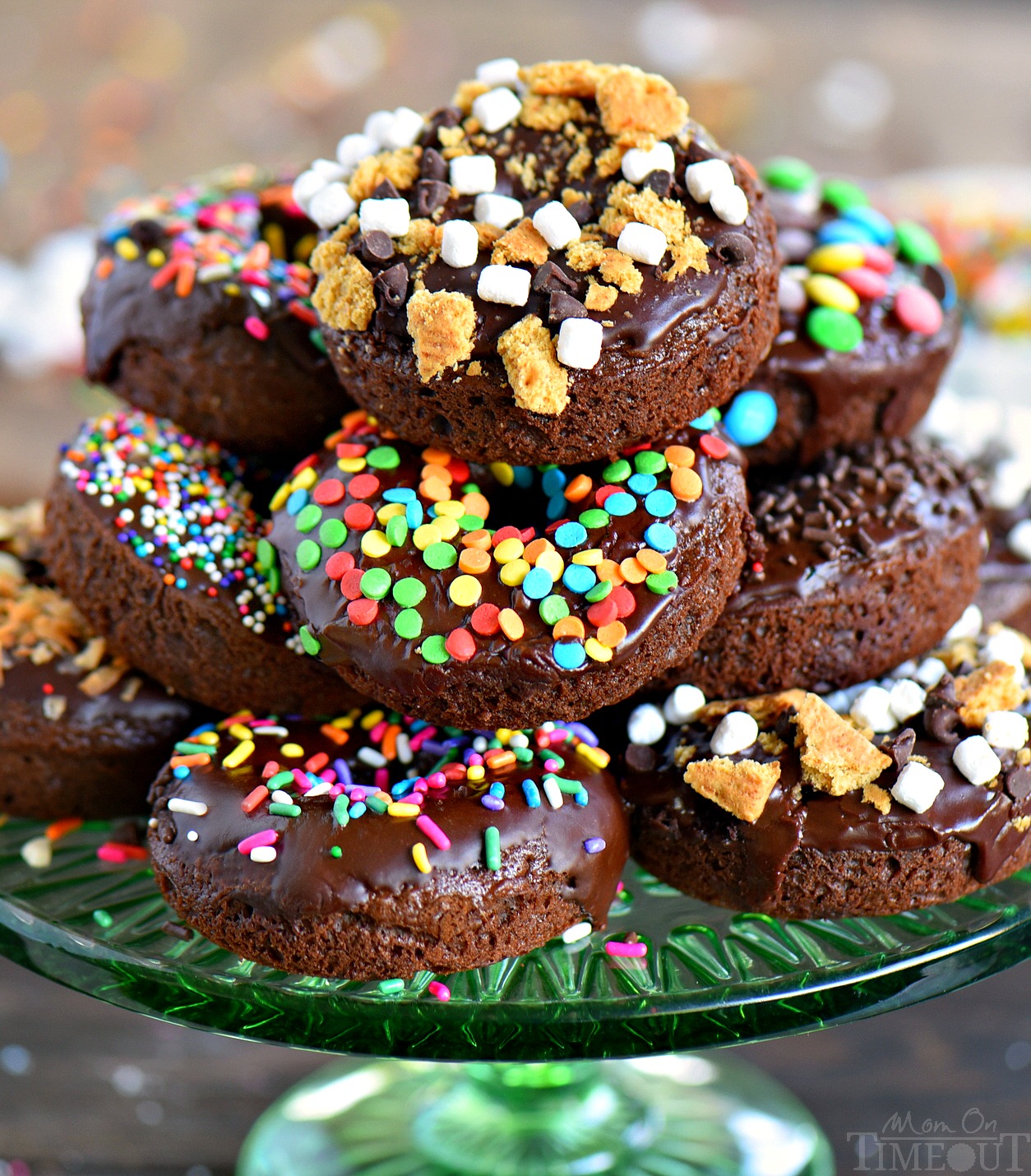 Give me ALL the donuts! Start your mornings off right with CHOCOLATE! These Chocolate Cake Mix Donuts are topped with a silky chocolate glaze and an assortment of fun toppings. S'mores, Almond Joy, sprinkles - which will be your new favorite? // Mom On Timeout #donuts #chocolate #cakemix #breakfast #brunch #dessert #ad