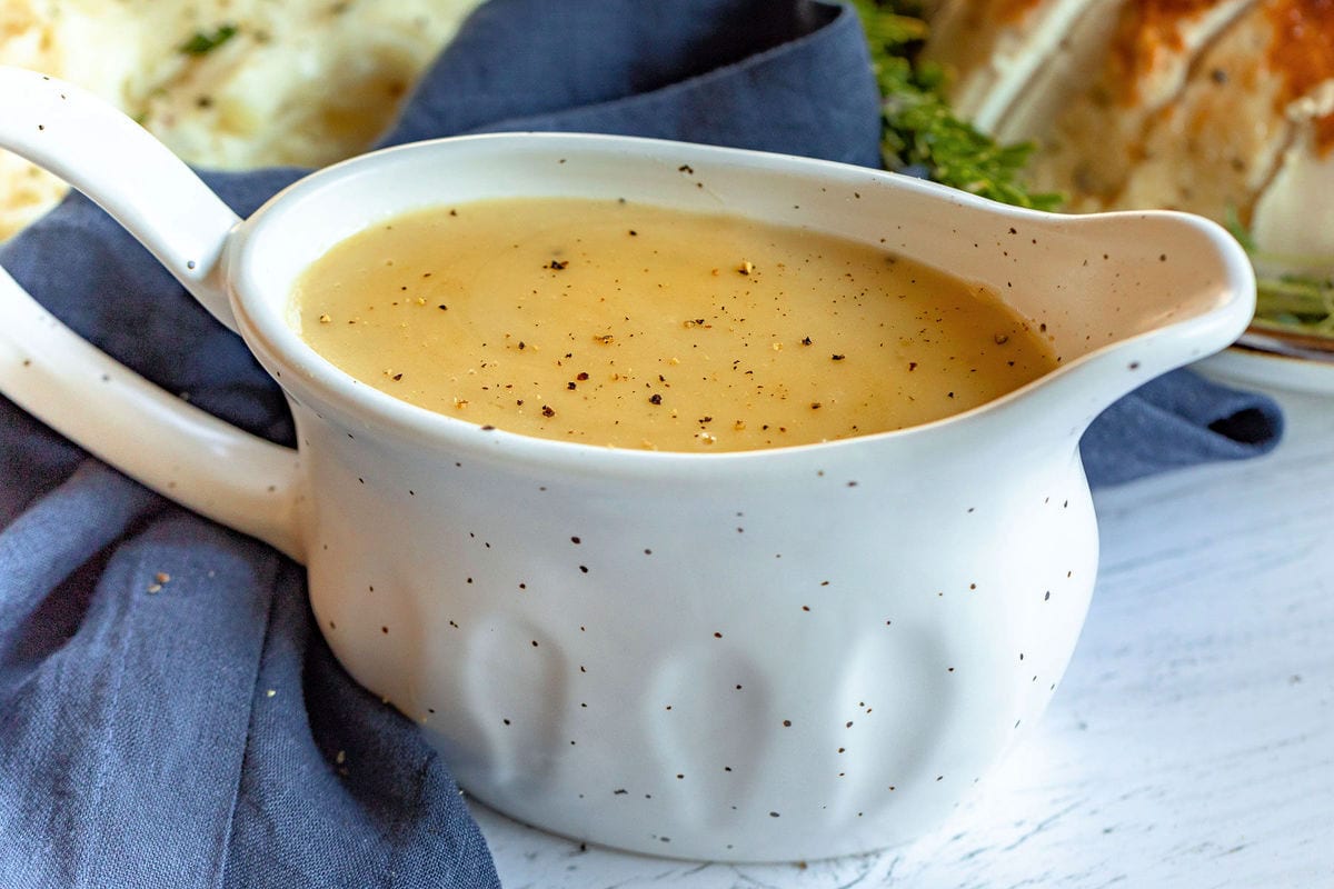 a large gravy boat filled with turkey gravy ready to be served.