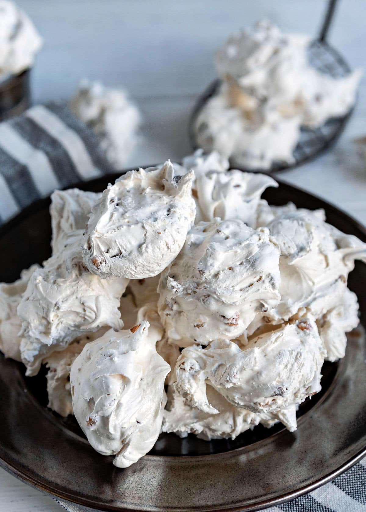 silver plate topped with lots of divinity candy piled high ready to be enjoyed.