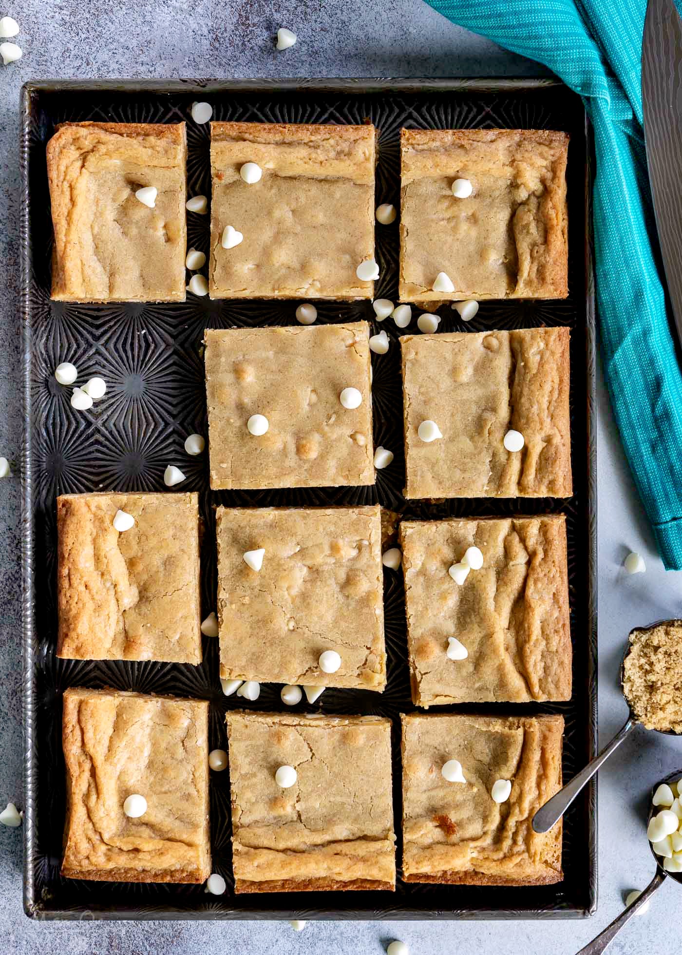 top down view of blondies cut into squares and sitting on vintage sheet pan.
