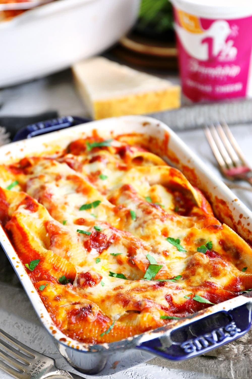 Delicious Stuffed Shells are the perfect easy, weeknight dinner. Jumbo pasta shells are stuffed with a smooth, creamy, cheesy filling flavored with fresh herbs and baked to absolute perfection. // Mom On Timeout #pasta #dinner #recipe #easy #shells #stuffedshells #cheese #vegetarian stuffed-shells-small-baking-dish