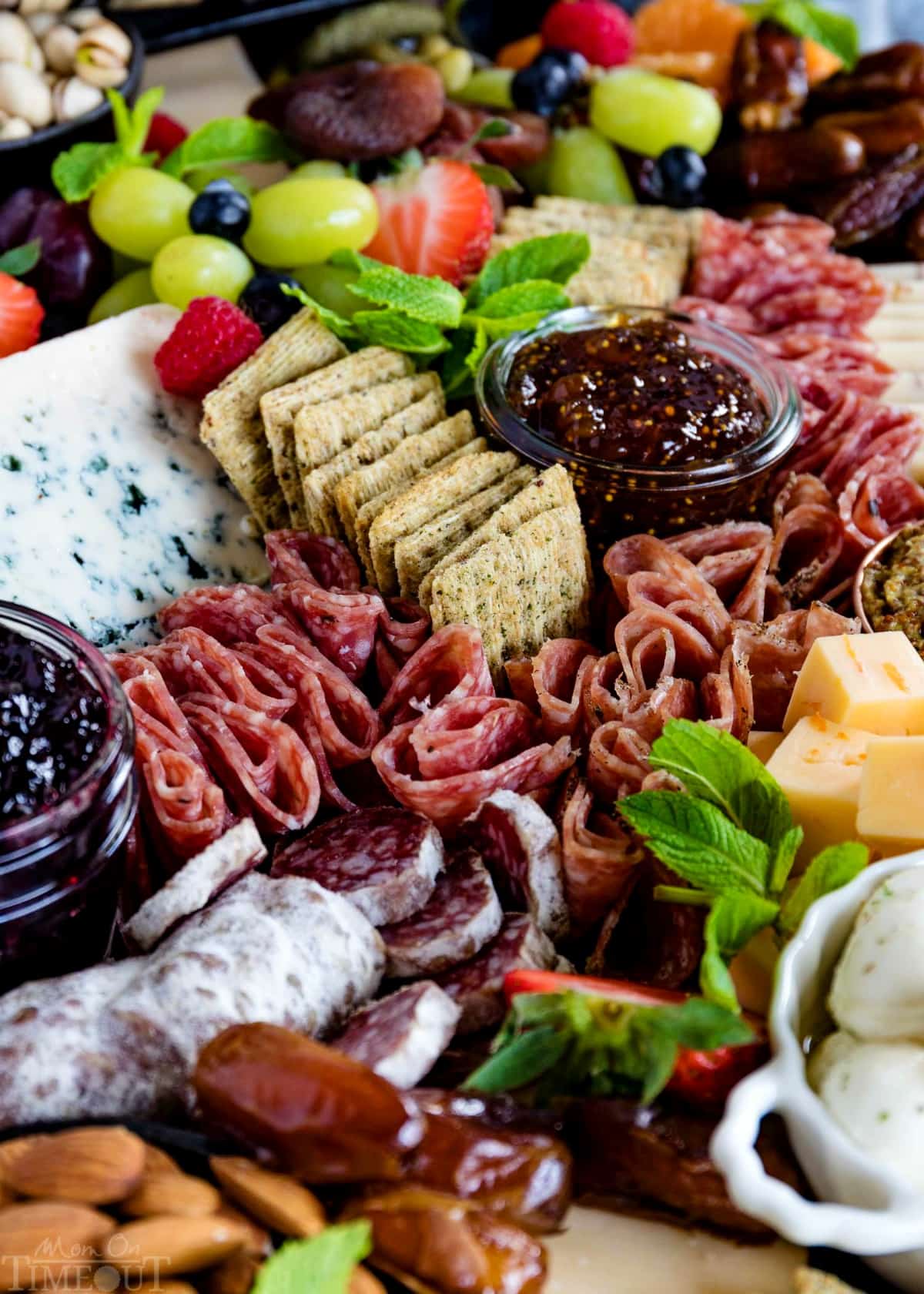 charcuterie-board-easy-cured-meats-dried-fruits-almonds-bowls