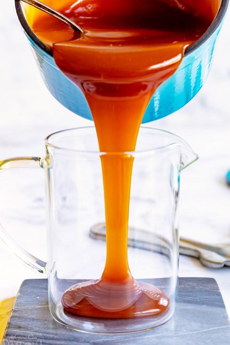 caramel-sauce-being-poured-into-glass-jar