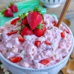 strawberry-fluff-in bowl topped with fresh strawberries in bowl