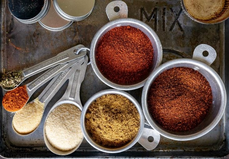 taco seasoning mix ingredients in measuring spons and cups