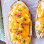 twice baked potatoes on serving board