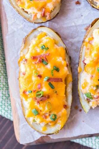 twice baked potatoes on serving board