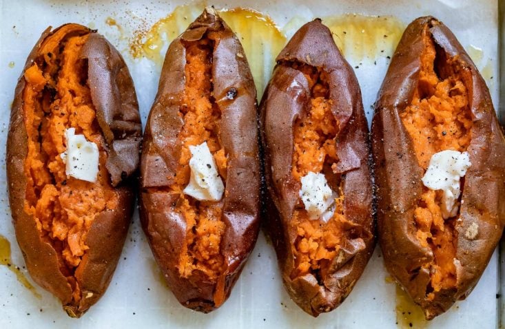 baked sweet ptotatoes on baking sheet rotated