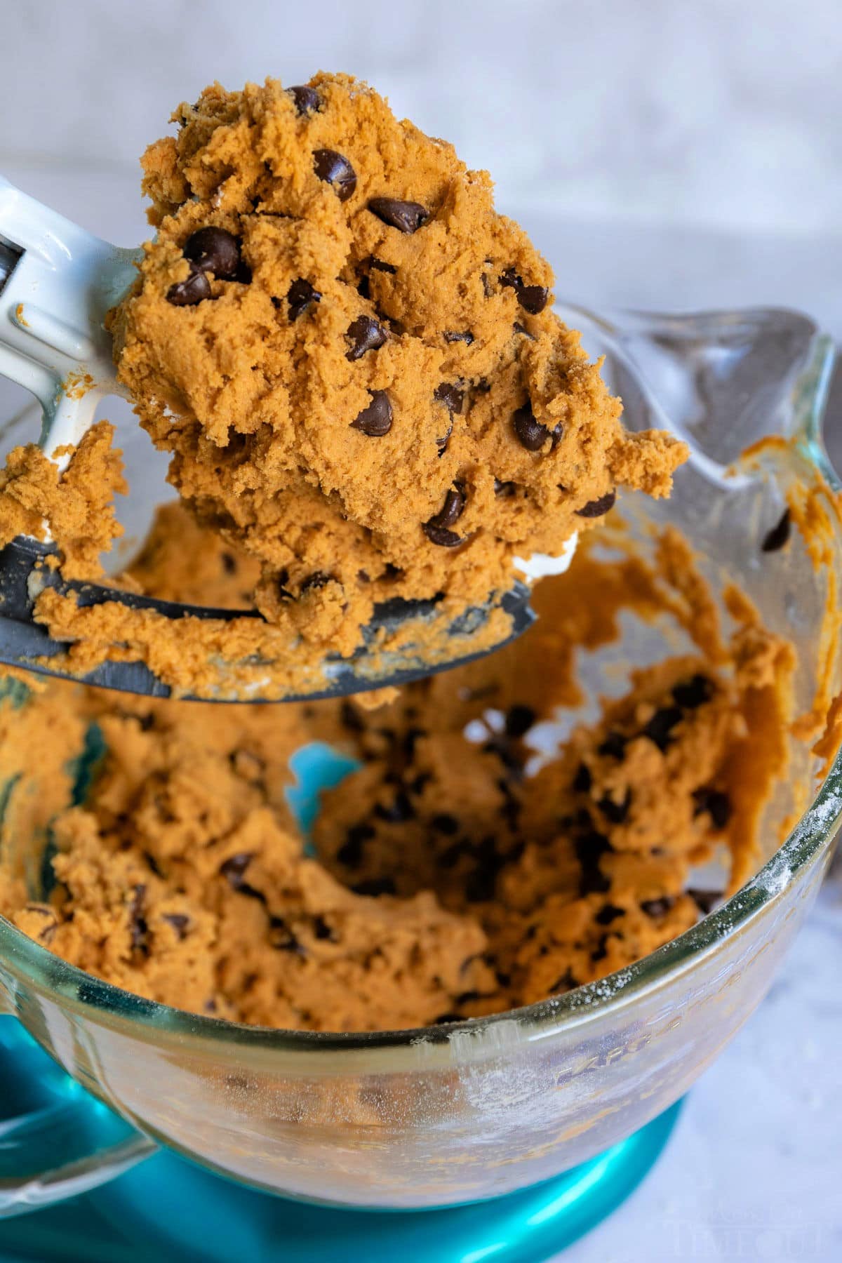 pumpkin chocolate chip cookie recipe dough in mixing bowl still on beater and in bowl.