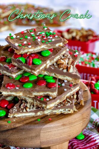 christmas crack recipe on wood stand piled high with nuts sprinkles mms 2